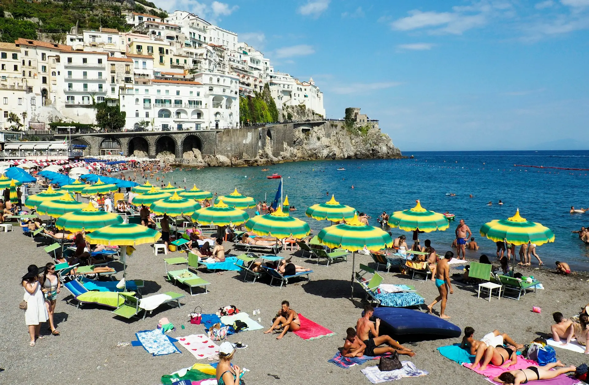 people on beach shore during daytime